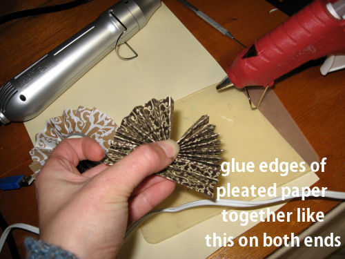After you glue the edges together you need to squirt a dab of glue in the middle and hold it until it cools.